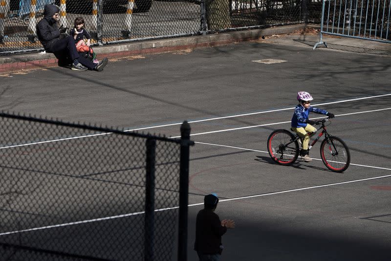 People play in a park during the outbreak of Coronavirus disease (COVID-19), in the Manhattan borough of New York City,