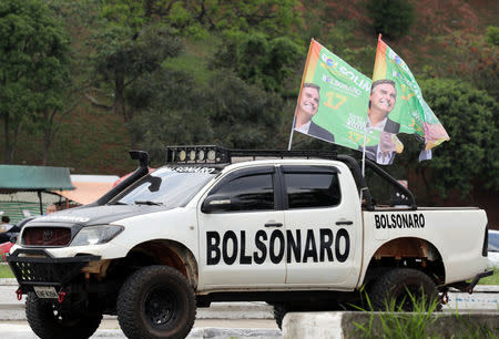 A supporter of presidential candidate Jair Bolsonaro attends a demonstration at Pacaembu Stadium in Sao Paulo, Brazil September 29, 2018. Picture taken September 29, 2018. REUTERS/Paulo Whitaker