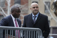 Craig Carton, right, the former co-host of a sports radio show with ex-NFL quarterback Boomer Esiason, arrives at federal court to be sentenced for defrauding investors in a ticket reselling business, Friday, April 5, 2019, in New York. (AP Photo/Mark Lennihan)