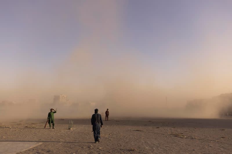 People play at a cricket park in Kabul