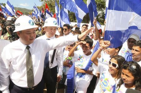 HK Nicaragua Canal Development Investment Co Ltd (HKND Group) Chairman Wang Jing greets youths during the start of the first works of the Interoceanic Grand Canal in Brito town December 22, 2014, in this handout provided by the Presidential Palace Nicaragua. REUTERS/Jairo Cajina/Presidential Palace Nicaragua/Handout via Reuters