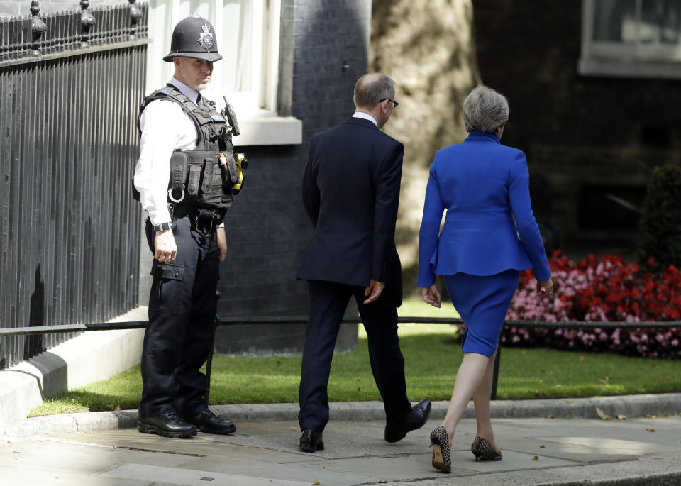 Britain's Prime Minister Theresa May, with her husband Philip May, leaves 10 Downing Street, London for Buckingham Palace, Wednesday, July 24, 2019. Boris Johnson will replace May as Prime Minister later Wednesday, following her resignation last month after Parliament repeatedly rejected the Brexit withdrawal agreement she struck with the European Union. (AP Photo/Matt Dunham)