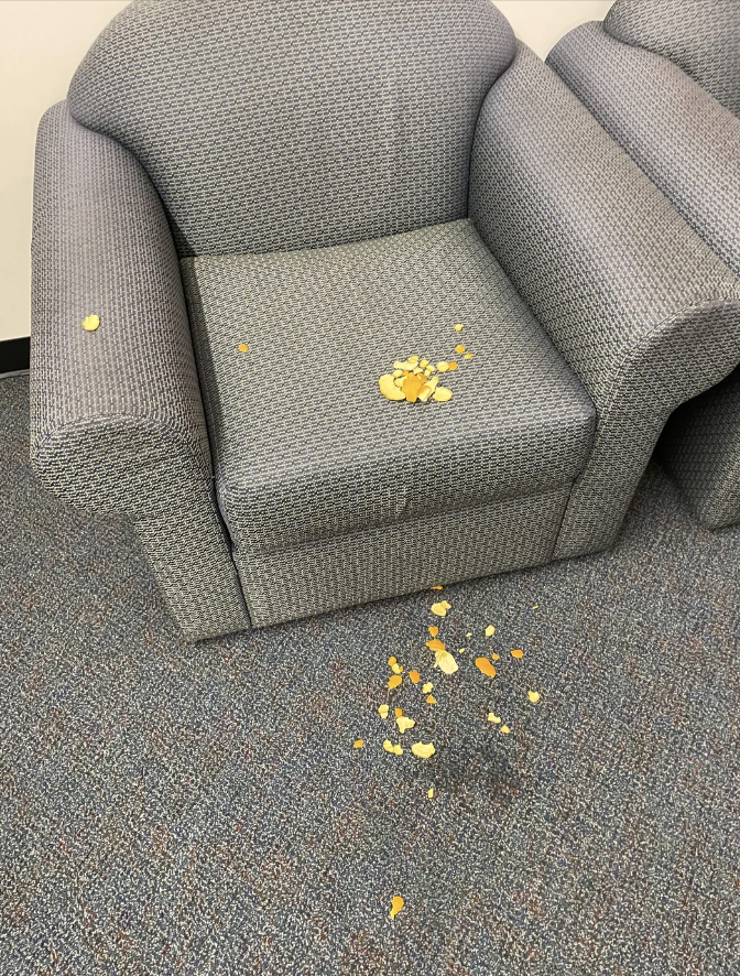 Chips all over a chair and the floor