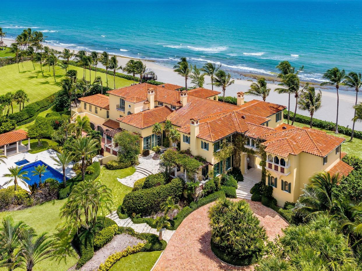 Aerial view of Florida mansion owned by Larry Ellison with view of pool and ocean