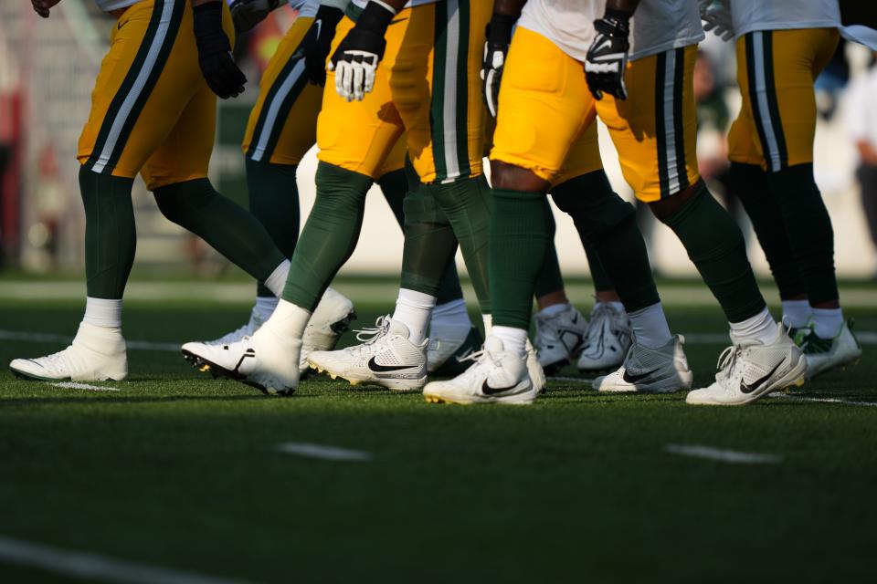 The Green Bay Packers offensive line warms up before a Week 1 NFL preseason game between the Green Bay Packers and the Cincinnati Bengals,Friday, Aug. 11, 2023, at Paycor Stadium in Cincinnati.