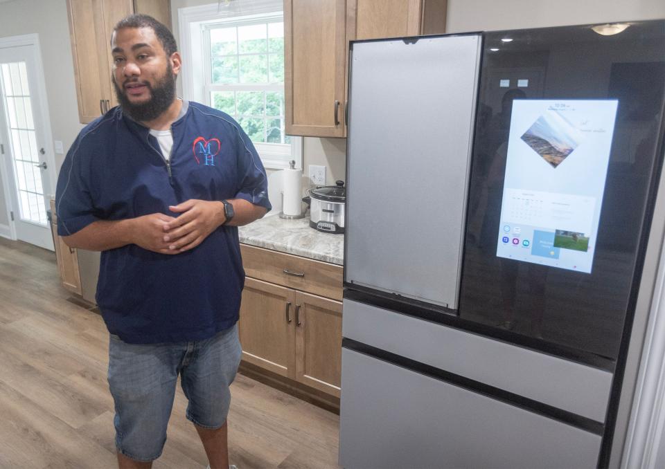Juron Martin, program director at Midwest Health Services, talks about the "smart" fridge in Stark County's first "Smart Home" for people with developmental disabilities.