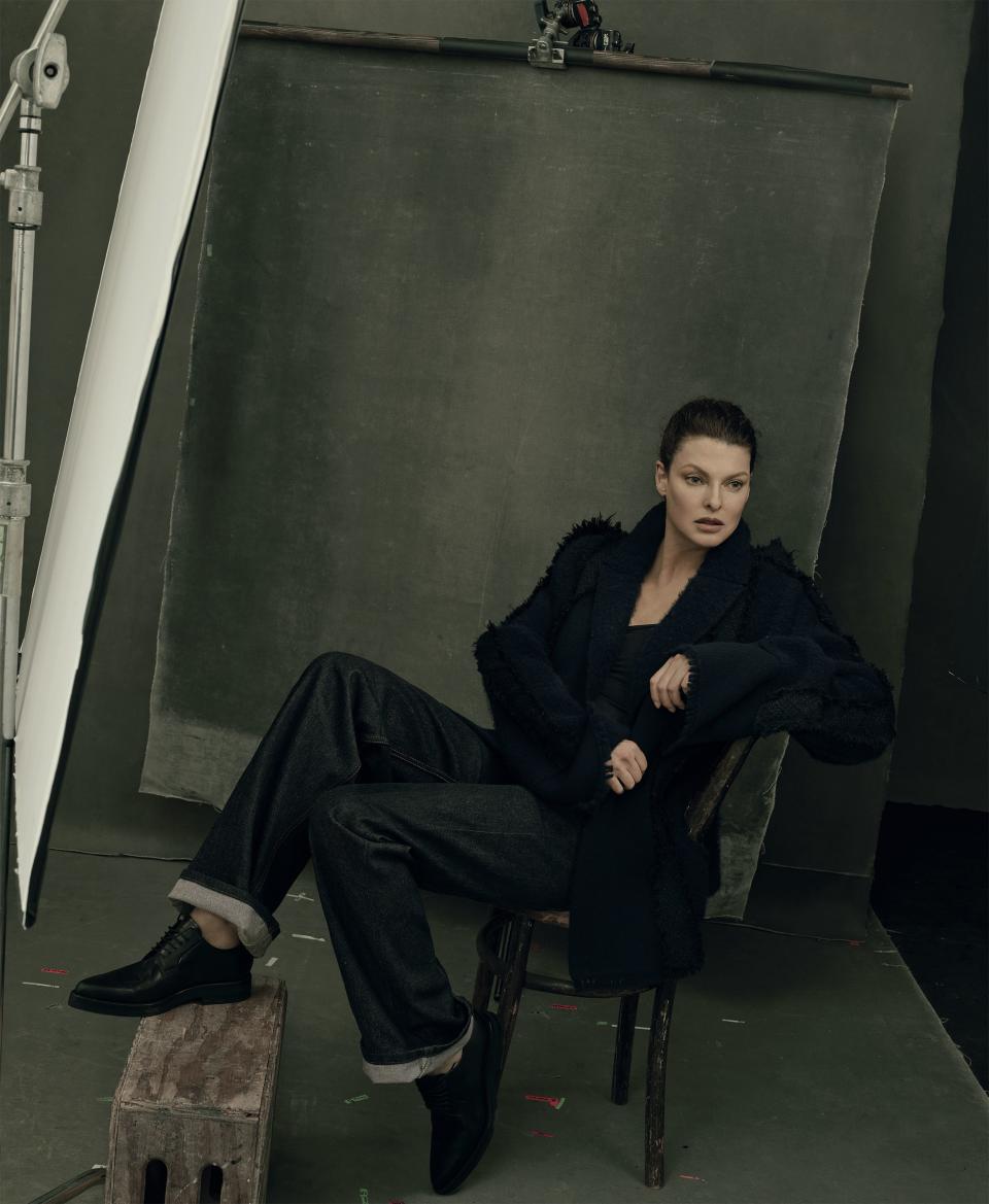 <em>“I’ve been dangled from a window; I’ve sat on a ball and hung from a ladder—I would have done anything to get a good picture.” —Linda Evangelista.</em> Evangelista wears a Chanel jacket; select Chanel boutiques. Marc Jacobs jeans, $295; select Marc Jacobs stores. Dries Van Noten shoes.