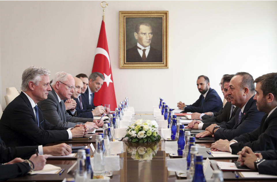 Turkish Foreign Minister Mevlut Cavusoglu, second right, and U.S. National Security Advisor Robert O'Brien attend a meeting, in Ankara, Turkey, Thursday, Oct. 17, 2019. Vice President Mike Pence, heading a U.S. delegation, is set to arrive in Ankara Thursday afternoon, a day after Trump dismissed the very crisis he sent his aides on an emergency mission to douse. (Turkish Foreign Ministry via AP, Pool)