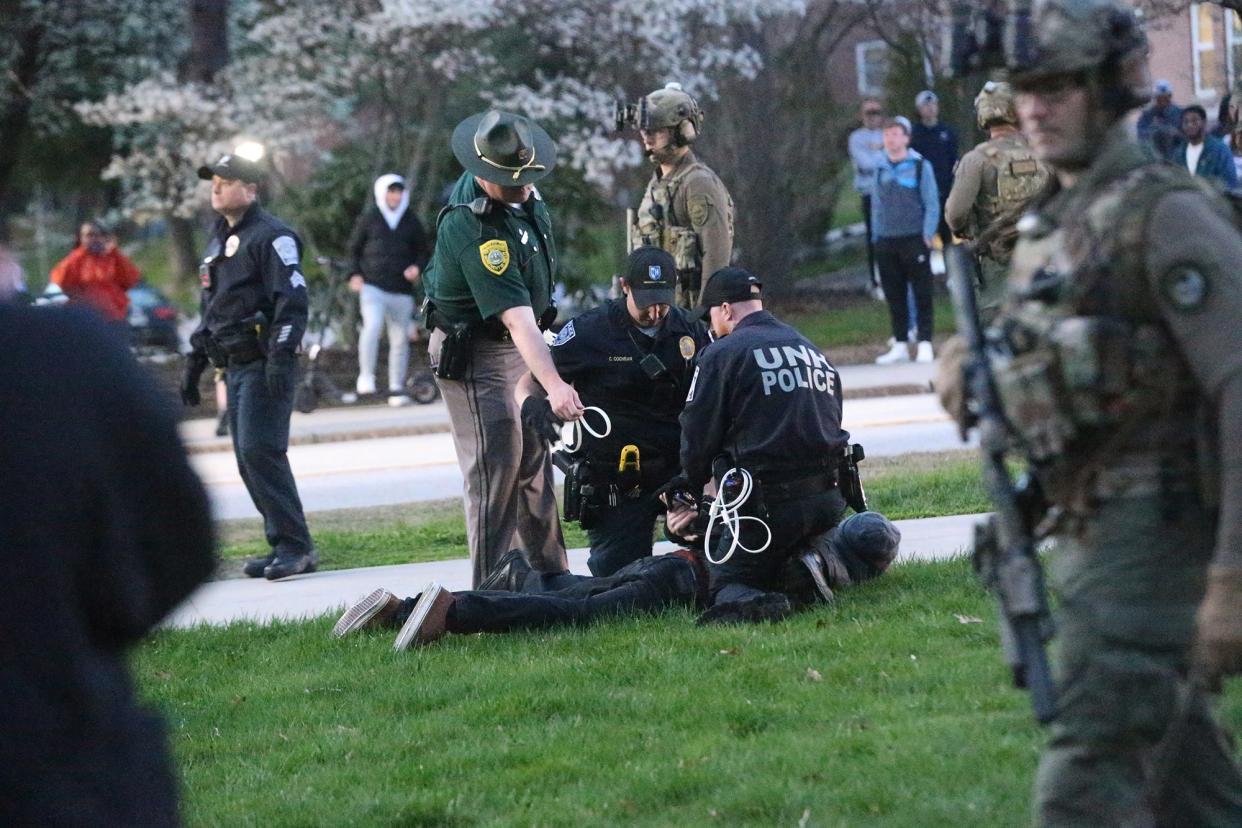 Police took action to remove and arrest pro-Palestinian protesters who started setting up an encampment in front of the University of New Hampshire's Thompson Hall Tuesday night May 1, 2024.