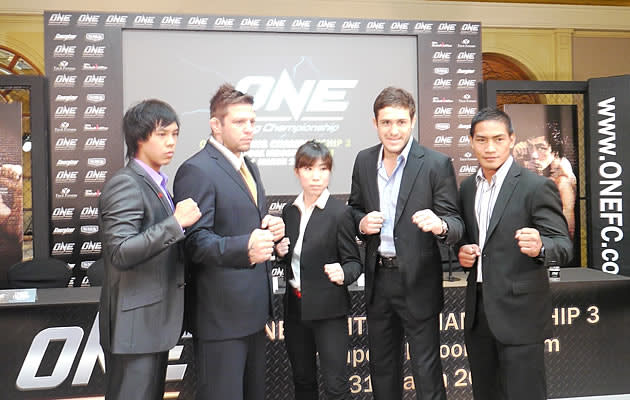 Nicole Chua with flanked by top MMA fighters