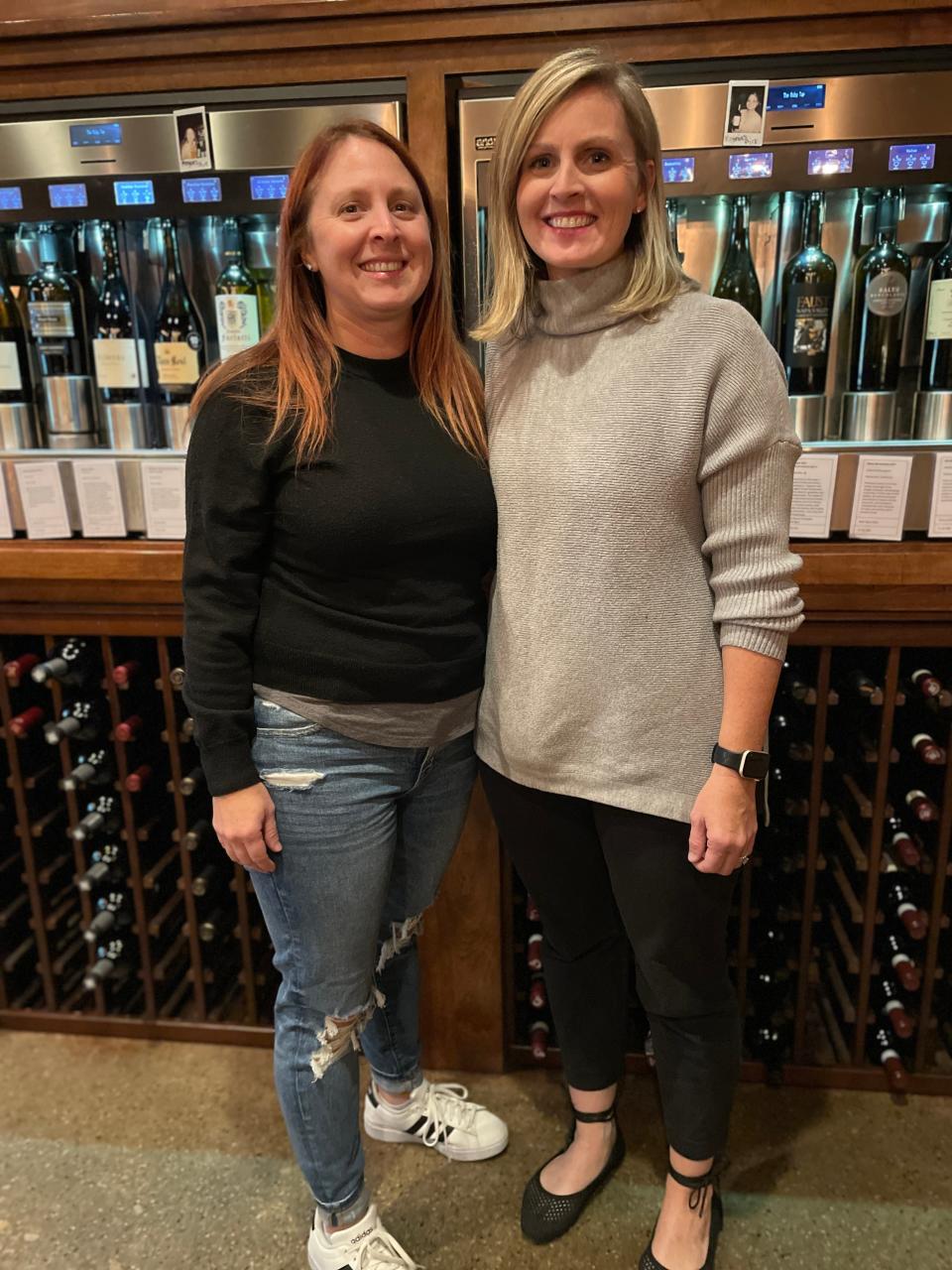 Sisters Brooke Smith, left, and Sarah Nelson, owners of Ruby Tap Wauwatosa and Ruby Tap Mequon, are big believers in wine on tap and love to introduce customers to wines with the self-serve pours. Staff also provide tasting notes and favorite selections as noted on the machines.
