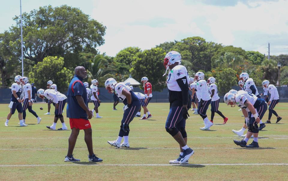 The Patriots warm up in the heat and humidity of South Florida Wednesday while preparing to play the Dolphins on Sunday.