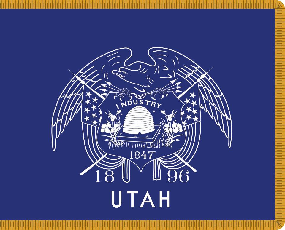 This flag, made in 1903, is considered Utah’s first state flag, although it was never specifically made such by law. The 1911 statute designated a very similar flag that had “Utah” on the shield. This flag did not have “Utah” on it until around the time the 1911 statute passed. | Illustration by Michael De Groote