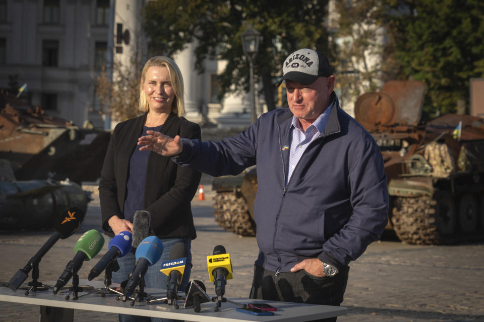 U.S. Sen. Mark Kelly, D-Ariz., right, and U.S. Ambassador to Ukraine Bridget Brink answer media questions in Kyiv, Ukraine, Monday, Sept. 18, 2023. (AP Photo/Efrem Lukatsky)