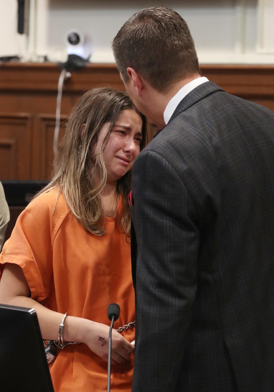 Sydney Powell listens to her attorney Don Malarcik after her sentencing in Summit County Common Pleas Judge Kelly McLaughlin's courtroom. Powell was sentenced to 15 to life for the stabbing death of her mother.