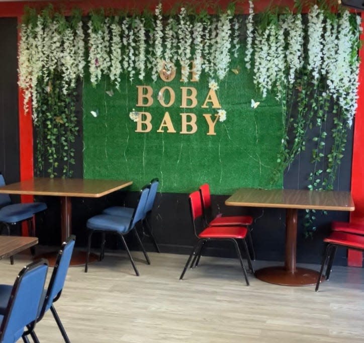 The inside of Yuki House has splashes of color and floral elements throughout, including an “Oh Boba Baby” mural in the main dining area.