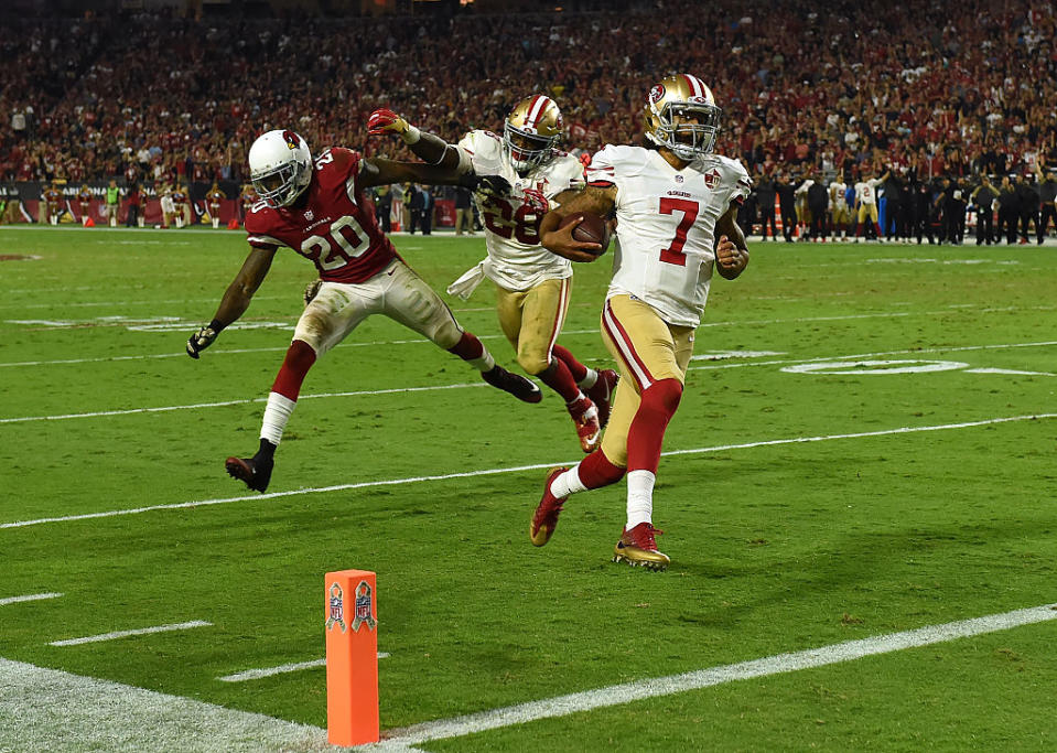 Colin Kaepernick makes a house call against the Cardinals. (Photo by Norm Hall/Getty Images)