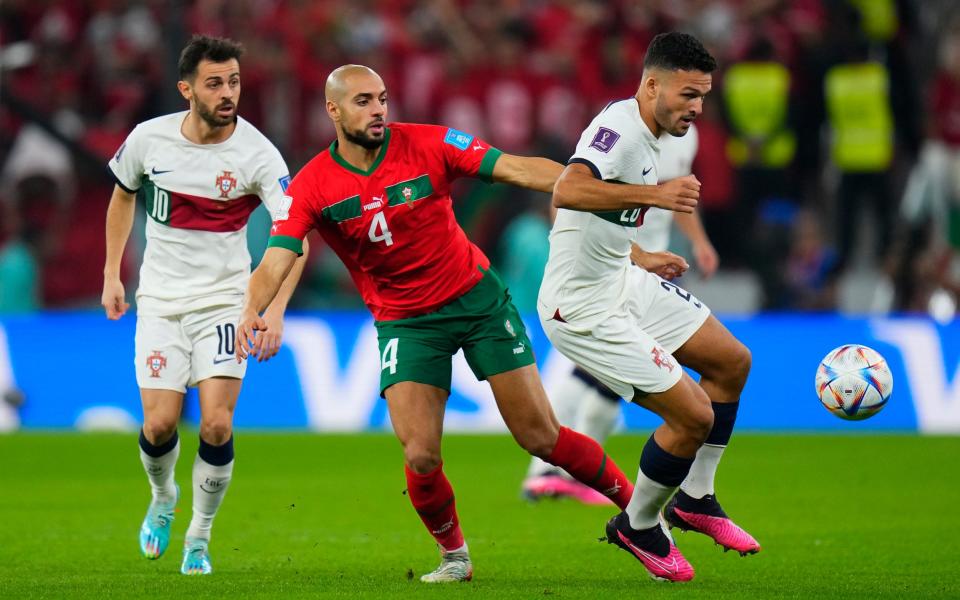 Portugal's Goncalo Ramos, right, is challenged by Morocco's Sofyan Amrabat during the World Cup - AP