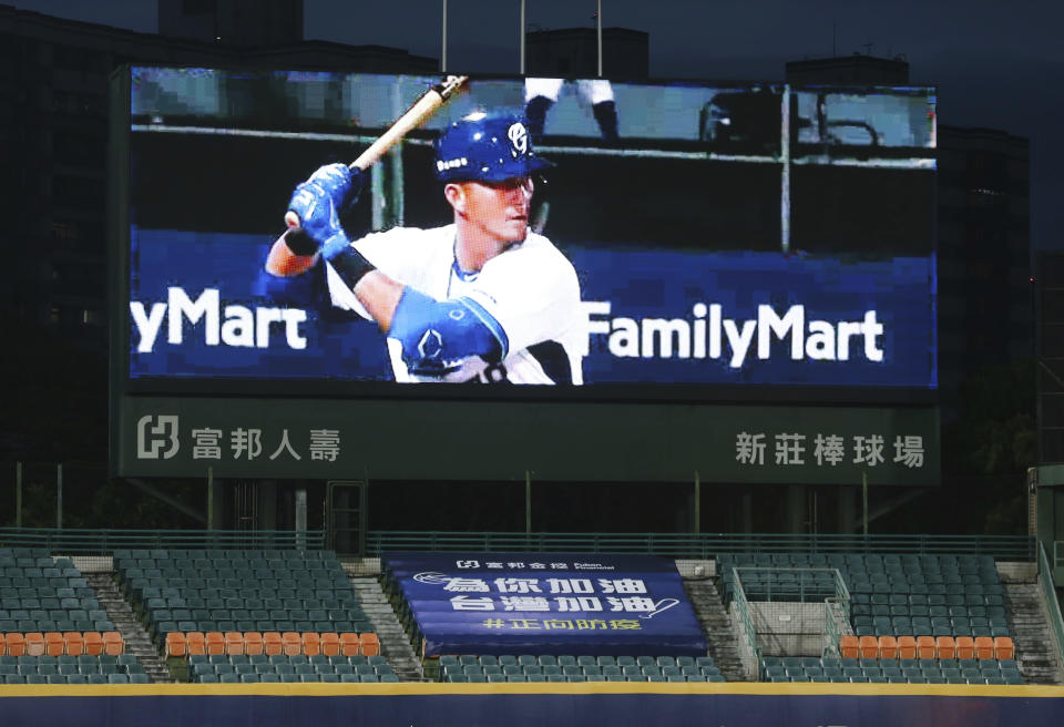 This photo shows a slogan reading ''Add Oil for You. Add Oil for Taiwan. Forward Epidemic Prevention'' on the Stadium stands with no audience at Xinzhuang Baseball Stadium in New Taipei City, Taiwan, Friday, April 24, 2020. ''Add oil'' means Chinese-language line of encouragement. Taiwan's five-team Chinese Professional Baseball League is barring spectators over concerns they would spread the deadly coronavirus, meaning games are played with plastic seats void of fans. (AP Photo/Chiang Ying-ying)