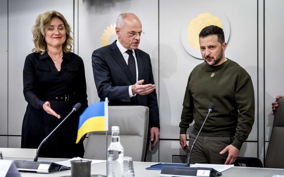 Ukrainian President Volodymyr Zelensky (R) attends a meeting with the President of the Senate Jan Anthonie Bruijn (C), and the Speaker of the House of Representatives, Vera Bergkamp (L) and members of the Senate and the House of Representatives, in The Hague - Remko de Waal/EPA-EFE/Shutterstock/Shutterstock