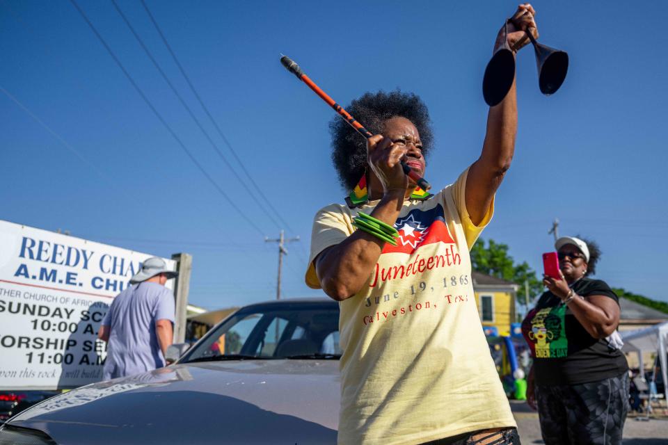 <p>Brandon Bell/Getty Images</p> GALVESTON, TEXAS - JUNE 19: Community member Jackie Douglas celebrates after residents marched from the Galveston County Courthouse on June 19, 2022 in Galveston, Texas. 