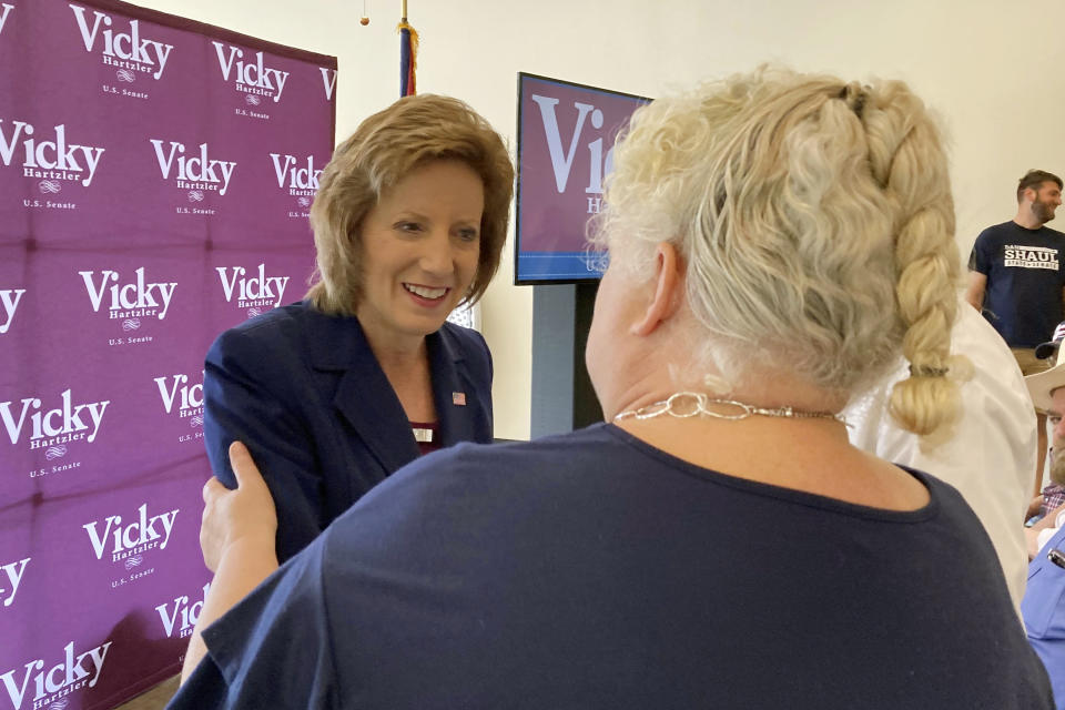 U.S. Rep. Vicky Hartzler, left, greets people during a campaign stop in Pevely, Mo., on Thursday, July 28, 2022. Hartzler is among 21 Republicans running for a U.S. Senate seat in Missouri. Eleven Democrats also are on the ballot in the primary election on Tuesday. (AP Photo/Jim Salter)