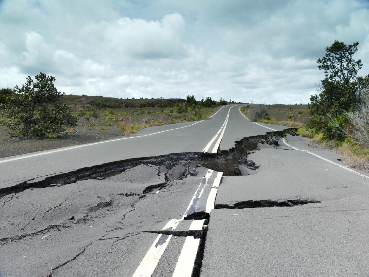 Hawaii Volcanoes National Park, Hawai’i - September 16, 2019:  A large fracture crosses Crater Rim Drive near Kilauea Caldera due to recent eruptions and the resulting subsidence.