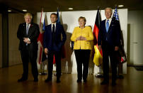 FILE - U.S. President Joe Biden, from right, German Chancellor Angela Merkel, French President Emmanuel Macron and British Prime Minister Boris Johnson pose prior to a meeting on the sidelines of the G20 summit in Rome, Oct. 30, 2021. Merkel has been credited with raising Germany’s profile and influence, helping hold a fractious European Union together, managing a string of crises and being a role model for women in a near-record tenure. Her designated successor, Olaf Scholz, is expected to take office Wednesday, Dec. 8, 2021. (AP Photo/Evan Vucci, File)