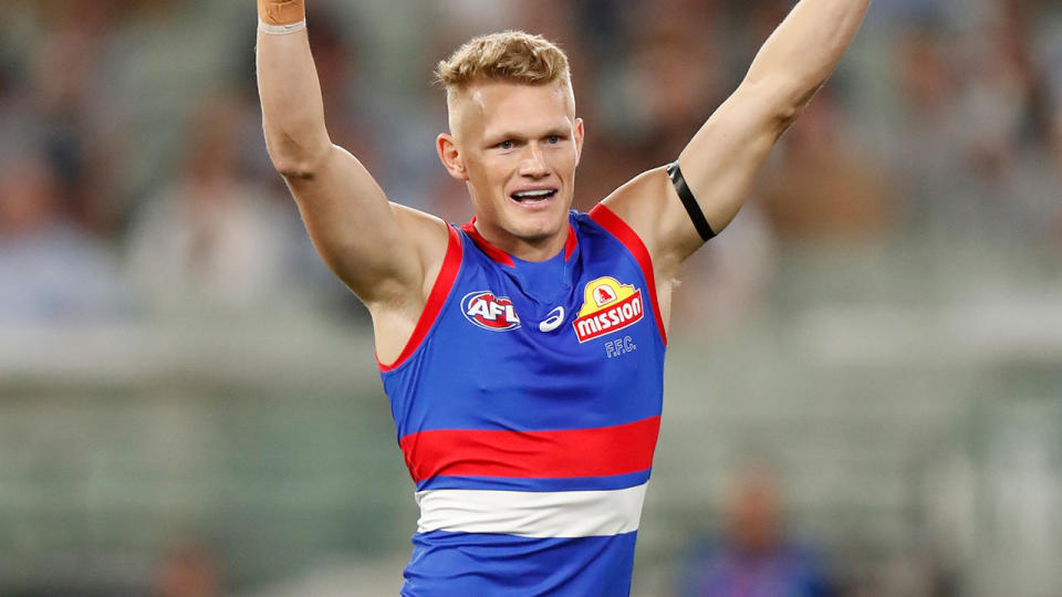 Adam Treloar, pictured bere celebrating the Western Bulldogs' win over Collingwood.