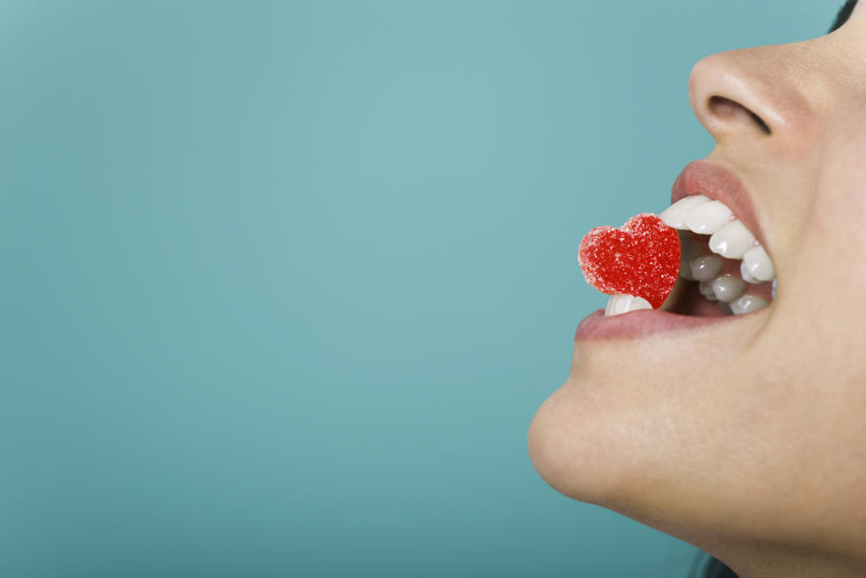 A person bites a heart-shaped candy. The context of the article is Goodful