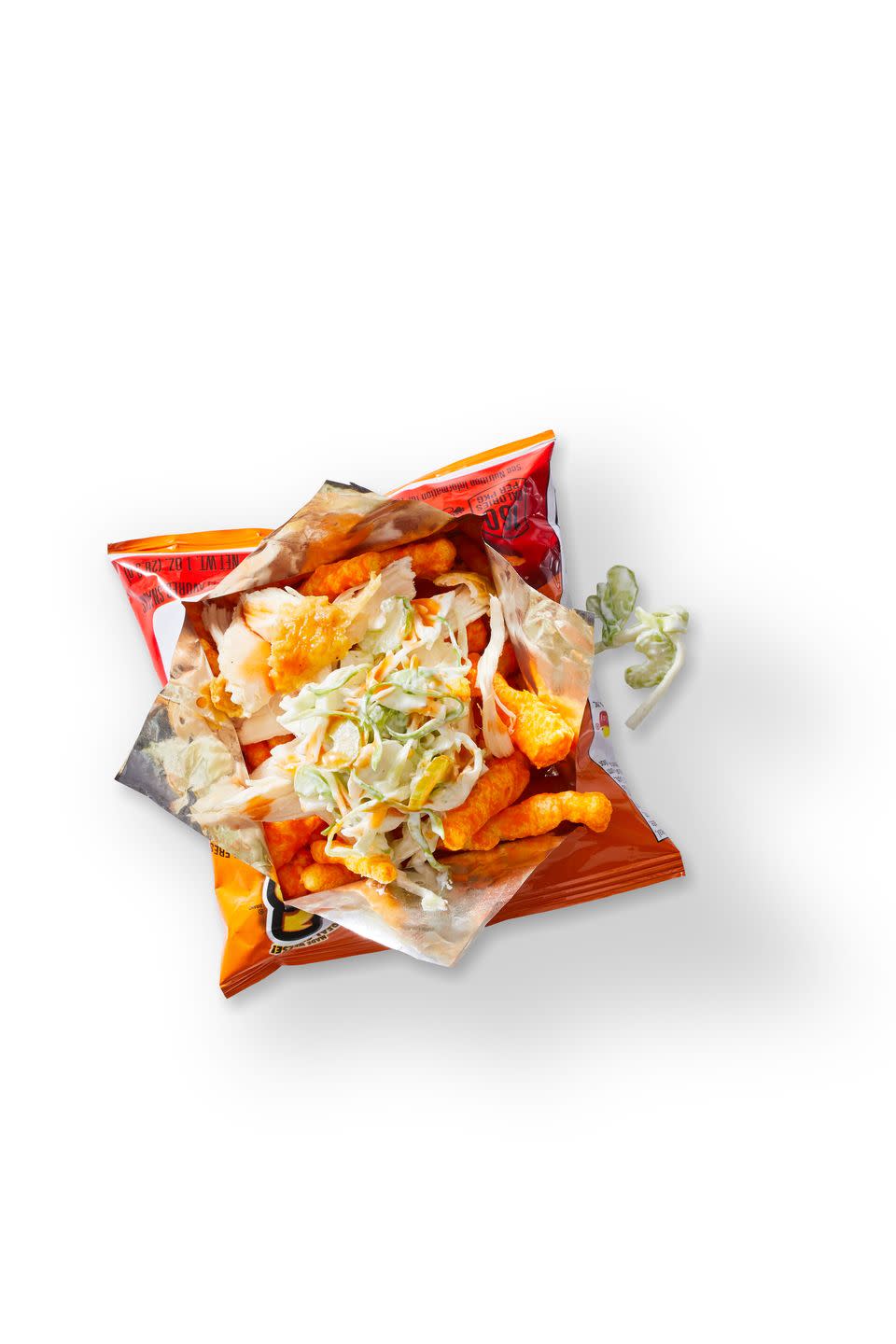 <p>Turn a bag of Cheetos into a buff-chick snack with shredded chicken, hot sauce and blue cheese. You'll want more than one.</p><p>Get the <a href="https://www.goodhousekeeping.com/food-recipes/a35182676/red-hot-and-blue-chicken-snack-bag-recipe/" rel="nofollow noopener" target="_blank" data-ylk="slk:Red Hot and Blue Chicken Snack Bag recipe;elm:context_link;itc:0;sec:content-canvas" class="link "><strong>Red Hot and Blue Chicken Snack Bag recipe</strong></a>.</p>