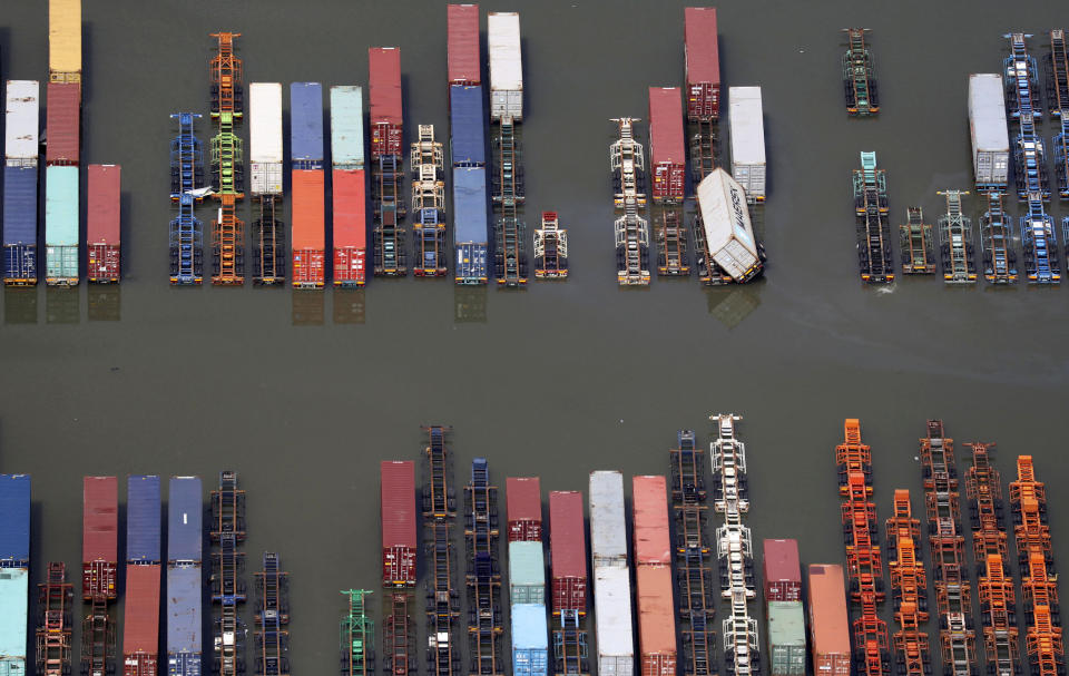 Flooded cargo port is seen after typhoon hit the area Monday Sept. 9, 2019 in Yokohama, south of Tokyo. A powerful typhoon has passed over Tokyo, halting major train lines affecting morning rush-hour commuters and knocking over scaffolding and causing other damage. (Kyodo News via AP)