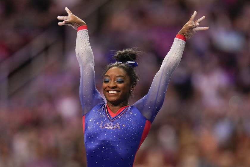 Simone Biles celebrate her performance on the vault during the women's U.S. Olympic Gymnastics Trials Friday, June 25, 2021, in St. Louis. (AP Photo/Jeff Roberson)