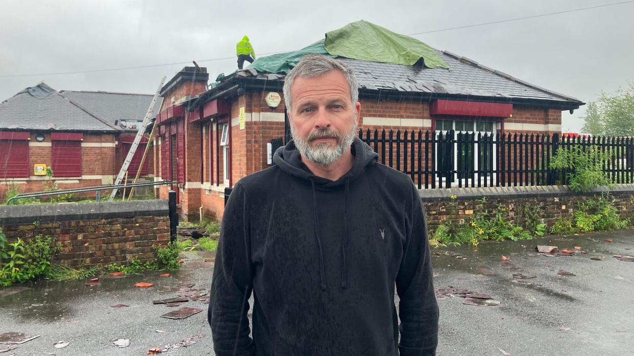 Andrew Brown, the chair of trustees at Harbour Place, stands outside the damaged building