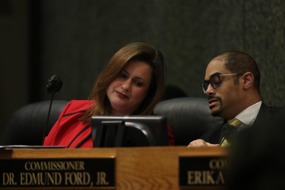 Shelby County commissioners Edmund Ford, Jr. and Amber Mills talk during a county commission in December 2022.