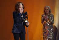 Bonnie Raitt accepts the award for song of the year for "Just Like That" at the 65th annual Grammy Awards on Sunday, Feb. 5, 2023, in Los Angeles. First Lady Jill Biden looks on from right. (AP Photo/Chris Pizzello)