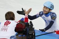 Winner Victor An (R) of Russia celebrates after the men's 1,000 metres short track speed skating final event at the Iceberg Skating Palace during the 2014 Sochi Winter Olympics February 15, 2014. REUTERS/Eric Gaillard