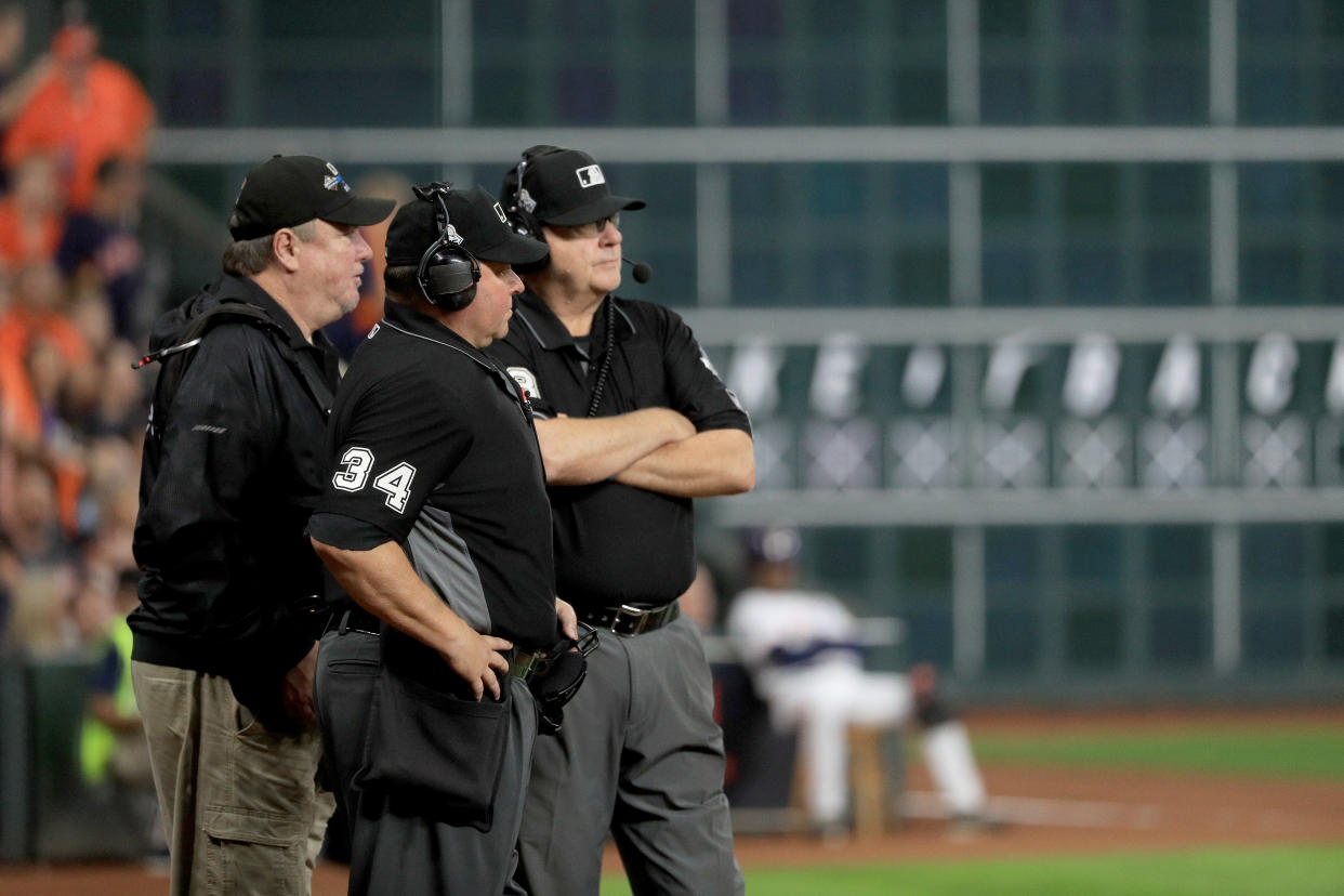 MLB umpires will be mic'd up in 2020 to explain replay rulings to fans. (Photo by Mike Ehrmann/Getty Images)