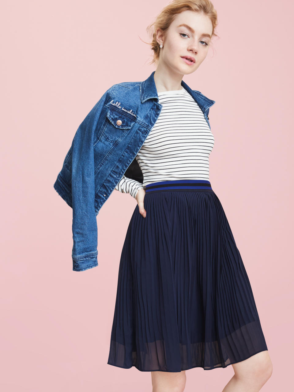 Monogrammed denim jacket and pleated skirt