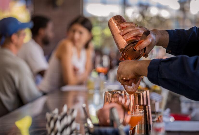 LOS ANGELES, CA - THURSDAY, JULY 7, 2023 - A bartender pours a cocktail at Loreto in Frogtown. (Ricardo DeAratanha/Los Angeles Times)