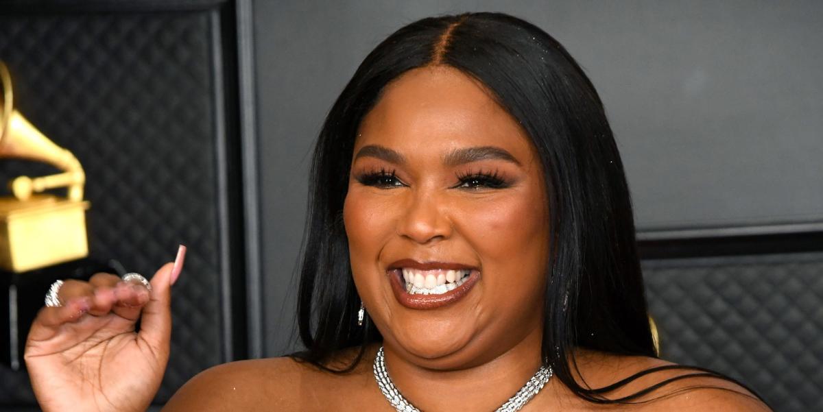 Lizzo struts in bum-baring leggings from new shapewear line and