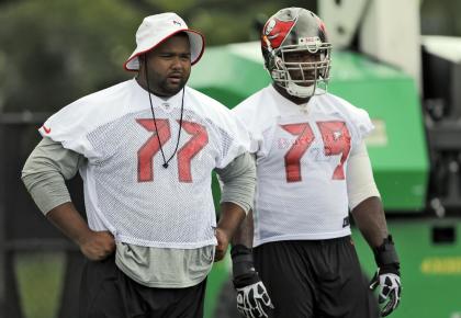 Carl Nicks (77) observes an offseason drills before leaving the team this summer. (AP)