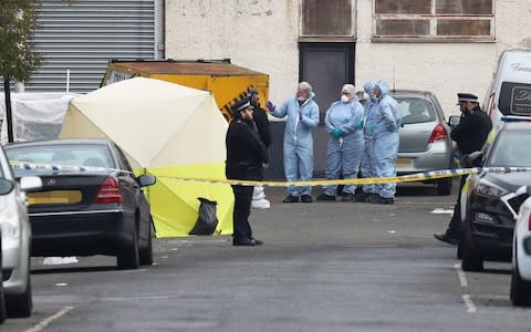 Forensic officers in Ilford - Credit: Jonathan Brady/PA