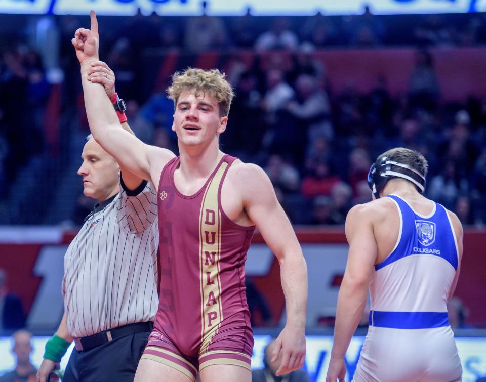 Dunlap's Nick Mueller celebrates his 4-2 decision over Vernon Hills' Illia Dvoriannikov in the 165-pound title match of the Class 2A state wrestling championships Saturday, Feb. 17, 2024 at the State Farm Center in Champaign.