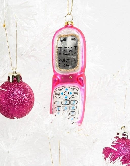 <p>Um, Christmas? As if! Deck your halls with subtle throwback vibes, like this pink flip-phone glass ornament.</p> <p><strong>Shop Now:</strong> Paperchase Holidays Flip Phone Bauble Decoration, $9.50, <a rel="nofollow noopener" href="https://us.asos.com/paperchase/paperchase-holidays-flip-phone-bauble-decoration/prd/10509023?clr=multi&SearchQuery=christmas&gridcolumn=1&gridrow=11&gridsize=4&pge=1&pgesize=72&totalstyles=939" target="_blank" data-ylk="slk:asos.com;elm:context_link;itc:0;sec:content-canvas" class="link ">asos.com</a></p>