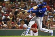 Jul 13, 2018; Boston, MA, USA; Toronto Blue Jays designated hitter Justin Smoak (14) hits an RBI single during the eighth inning against the Boston Red Sox at Fenway Park. Mandatory Credit: Bob DeChiara-USA TODAY Sports