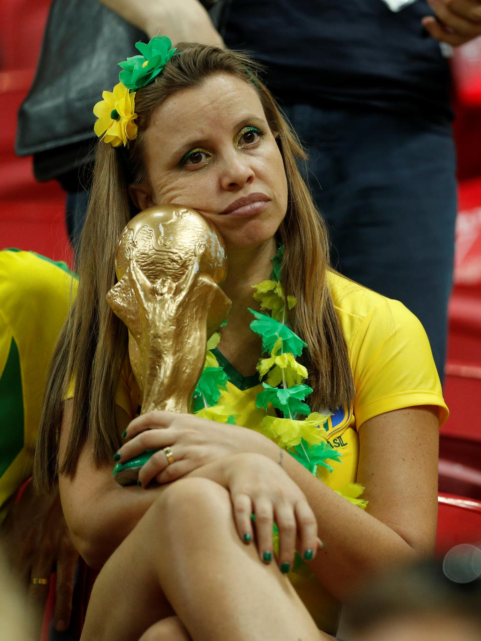<p>Brazil fan inside the stadium looks dejected after the match REUTERS/John Sibley </p>