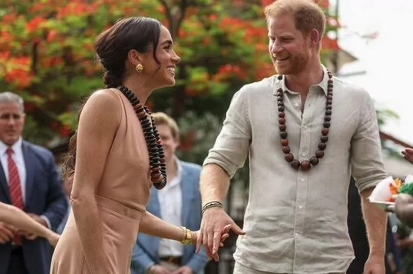 Harry and meghan smiling