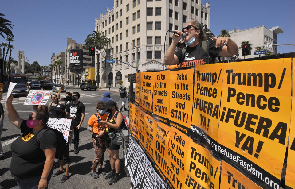 A woman speaks during a protest against President Donald Trump, Saturday, June 13, 2020, in the Hollywood section of Los Angeles. (AP Photo/Mark J. Terrill)