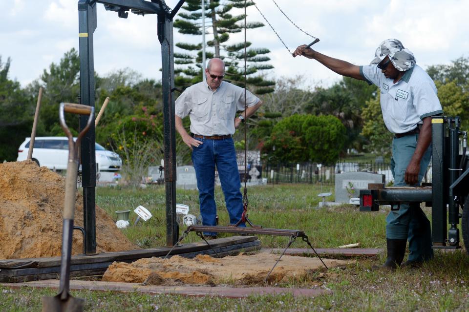 Employees from ABC Vault of Fort Pierce slowly lift a vault out of the ground at Winter Beach Cemetery April 21, 2016, containing the remains of an unidentified woman (identified March 12, 2024, as Evelyn Lois Horne Townsend, 43) found dead in a ditch on State Road 60 about 6 miles west of Interstate 95 in 1982. The Indian River County Sheriff's Office is having the body exhumed and taken to the C.A. Pound Human Identification Laboratory at the University of Florida in Gainesville to conduct a study of the body in hopes that a 3D scan of the skull will help lead to finding the identity of the woman.